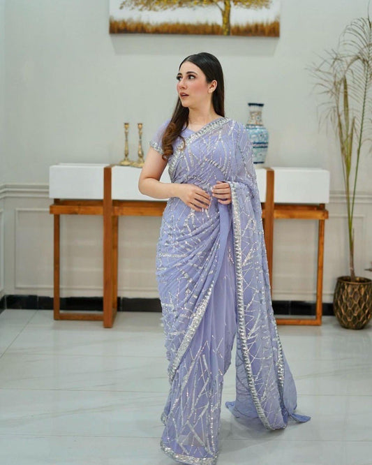 Magnificent light lavender colored designer sequence embroidered party wear saree